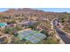 Aerial view of Anthem Country Club with pickleball, tennis courts, and a community pool at 42109 N Astoria Way, Anthem, AZ 85086