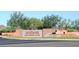 Entrance to Anthem Country Club featuring brick signage and a waterfall feature at the community entrance at 42109 N Astoria Way, Anthem, AZ 85086