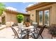 Charming courtyard with an outdoor seating area, features stone flooring and desert landscaping at 42109 N Astoria Way, Anthem, AZ 85086