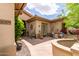 Inviting courtyard features stone flooring, desert landscaping, and a cozy outdoor seating area, great for relaxing at 42109 N Astoria Way, Anthem, AZ 85086