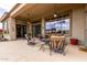 Spacious covered patio with comfortable seating, ceiling fans, and ample natural light at 42109 N Astoria Way, Anthem, AZ 85086