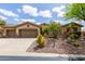 Charming home with a well-maintained exterior, desert landscaping, and a spacious two-car garage at 42109 N Astoria Way, Anthem, AZ 85086