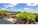Charming home features desert landscaping, a two-car garage, and a covered patio for outdoor seating at 42109 N Astoria Way, Anthem, AZ 85086