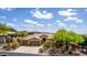 Beautiful home featuring a three-car garage, desert landscaping, and mountain views at 42109 N Astoria Way, Anthem, AZ 85086