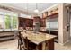 Gourmet kitchen with granite countertops, stainless steel appliances, and dark wood cabinetry is ideal for cooking at 42109 N Astoria Way, Anthem, AZ 85086