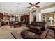 Spacious living room with an open layout with kitchen view at 42109 N Astoria Way, Anthem, AZ 85086