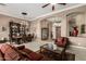 An open-concept living and dining area features elegant furniture and decor at 42109 N Astoria Way, Anthem, AZ 85086