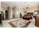 Spacious main bedroom with a seating area, decorative glass block accent wall, and neutral carpet at 42109 N Astoria Way, Anthem, AZ 85086