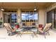 Inviting outdoor patio with comfortable seating, ceiling fans, and scenic views at 42109 N Astoria Way, Anthem, AZ 85086