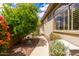 Serene side yard with a winding pathway and lush landscaping, offering a peaceful retreat at 42109 N Astoria Way, Anthem, AZ 85086