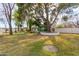 Spacious backyard with mature trees, a green gazebo, and landscaped areas offering serene outdoor enjoyment at 430 N Vineyard --, Mesa, AZ 85201