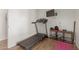Treadmill in the exercise room adjacent to a shelf of weights at 430 N Vineyard --, Mesa, AZ 85201