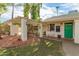 Charming home with a pergola, lush plants, and inviting front entrance at 430 N Vineyard --, Mesa, AZ 85201