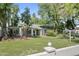 Quaint single story home with a manicured lawn, trees, and a white brick fence at 430 N Vineyard --, Mesa, AZ 85201