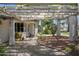 Covered porch with a paved path, flowering plants, and manicured bushes at 430 N Vineyard --, Mesa, AZ 85201