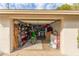 Spacious garage with motorcycle, shelving, and equipment at 430 N Vineyard --, Mesa, AZ 85201