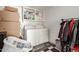 Convenient laundry room with a washer, dryer, and storage shelves at 430 N Vineyard --, Mesa, AZ 85201