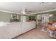 Open-concept living room boasts a fireplace, large windows, and a seamless flow to the kitchen and dining area at 430 N Vineyard --, Mesa, AZ 85201