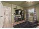 Living room featuring ceiling speakers, television, entertainment center, and a large area rug at 430 N Vineyard --, Mesa, AZ 85201