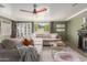 Comfortable living room with a cozy sectional, ceiling fan, and stylish decor for relaxed living at 430 N Vineyard --, Mesa, AZ 85201