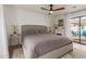 Relaxing main bedroom with fireplace and an outdoor view through a glass sliding door at 430 N Vineyard --, Mesa, AZ 85201