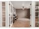 Home office with a brick accent wall, tiled floors, and glass french doors at 430 N Vineyard --, Mesa, AZ 85201