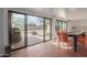 Enclosed patio with tiled floors, sliding glass doors, and outdoor seating at 430 N Vineyard --, Mesa, AZ 85201