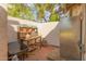 Functional outdoor storage area featuring shelving, a workbench, and ample space for gardening supplies at 430 N Vineyard --, Mesa, AZ 85201