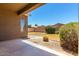 Backyard featuring gravel, grass, garden, and a covered patio and an outer fence for privacy at 44899 W Portabello Rd, Maricopa, AZ 85139
