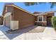 The front of the house shows great curb appeal and a bench on the front porch area at 44899 W Portabello Rd, Maricopa, AZ 85139