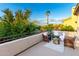 Relaxing outdoor patio featuring comfortable seating, lush greenery, and scenic views from the balcony at 4494 E Reins Rd, Gilbert, AZ 85297