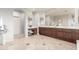 Bathroom featuring dual sinks, beautiful tile flooring, and ample counter space at 4494 E Reins Rd, Gilbert, AZ 85297