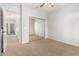Neutral bedroom with carpet and mirrored closet, doors to hallway at 4494 E Reins Rd, Gilbert, AZ 85297