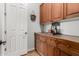 Butler's pantry with wood cabinets, countertop space, and storage, perfect for entertaining at 4494 E Reins Rd, Gilbert, AZ 85297