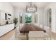 Elegant dining room featuring a long wooden table, seating for twelve, and large windows for natural light at 4494 E Reins Rd, Gilbert, AZ 85297