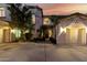 Charming home boasts a well-manicured lawn, mature trees, and a welcoming entrance at 4494 E Reins Rd, Gilbert, AZ 85297