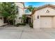 Well-maintained home featuring a lush lawn, attractive landscaping, and unique architectural detailing at 4494 E Reins Rd, Gilbert, AZ 85297
