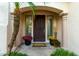 Inviting front entrance with a decorative door, potted plants, and a charming welcome mat at 4494 E Reins Rd, Gilbert, AZ 85297