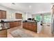 Modern kitchen with wooden cabinets, stainless steel appliances, and a spacious island at 4494 E Reins Rd, Gilbert, AZ 85297