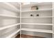 Walk-in pantry with ample shelving space for organized storage of food and household items at 4494 E Reins Rd, Gilbert, AZ 85297