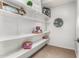 Walk-in storage featuring built-in shelving for games and home decor at 4494 E Reins Rd, Gilbert, AZ 85297