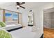 Bright bedroom featuring two beds, large window, and ample natural light at 4620 N 68Th St # 166, Scottsdale, AZ 85251