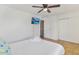 Bedroom featuring a queen bed, light wood floors, and a television on the wall at 4620 N 68Th St # 166, Scottsdale, AZ 85251