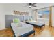 Bright bedroom featuring two twin beds, modern decor, and a ceiling fan at 4620 N 68Th St # 166, Scottsdale, AZ 85251