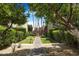A well-manicured common area with mature trees and shrubs create a tranquil outdoor space at 4620 N 68Th St # 166, Scottsdale, AZ 85251