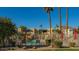 A view of the community pool with desert landscaping and distant mountain views at 4620 N 68Th St # 166, Scottsdale, AZ 85251
