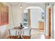 Bright dining area featuring a round table, unique chairs, and an open view into other parts of the home at 4620 N 68Th St # 166, Scottsdale, AZ 85251