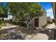 Charming condo with well-maintained landscaping, mature tree, and walkway leading to the front door at 4620 N 68Th St # 166, Scottsdale, AZ 85251