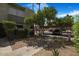 Exterior of home showing the front entrance, sidewalk, landscaping and covered parking at 4620 N 68Th St # 166, Scottsdale, AZ 85251