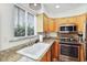 Well-lit kitchen with granite countertops and stainless steel appliances, bright window at 4620 N 68Th St # 166, Scottsdale, AZ 85251